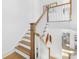 Modern staircase with wooden steps and white railings at 633 Mattie Rose Ln, Charlotte, NC 28204