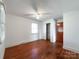 This bedroom features hardwood floors, a ceiling fan, and closet at 6523 Prospect Rd, Monroe, NC 28112