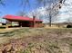 Exterior view of brick home with covered carport and nice yard at 6523 Prospect Rd, Monroe, NC 28112