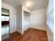 This laundry room features hardwood floors, a closet, and laundry machines at 6523 Prospect Rd, Monroe, NC 28112