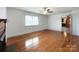 Bright living room with hardwood floors, fireplace and a large window providing natural light at 6523 Prospect Rd, Monroe, NC 28112