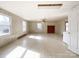 This living room features a brick fireplace and several windows at 6523 Prospect Rd, Monroe, NC 28112