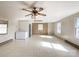 This living room features a brick fireplace and several windows at 6523 Prospect Rd, Monroe, NC 28112