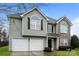 Two-story house with gray siding, stone accents, and a two-car garage at 675 Winding Branch Rd, Rock Hill, SC 29732