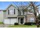 Two-story house with gray siding, stone accents, and a two-car garage at 675 Winding Branch Rd, Rock Hill, SC 29732