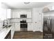 Kitchen with white cabinets, granite countertops, and stainless steel appliances at 675 Winding Branch Rd, Rock Hill, SC 29732