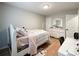 Charming bedroom with a white bed frame and wood floors at 7562 Silver Arrow Dr, Charlotte, NC 28273