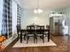 Dining area with black table and chairs, and light-colored walls at 7562 Silver Arrow Dr, Charlotte, NC 28273