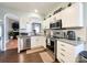 Modern kitchen with stainless steel appliances and white cabinets at 7562 Silver Arrow Dr, Charlotte, NC 28273