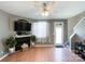 Living room with fireplace, hardwood floors, and access to patio at 7562 Silver Arrow Dr, Charlotte, NC 28273