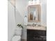 Bathroom with shower, vanity with granite countertop and decorative mirror at 7672 Nautical Vw, Denver, NC 28037