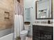 Bathroom with tub shower combo, granite vanity and decorative mirror at 7672 Nautical Vw, Denver, NC 28037