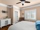 Bedroom with hardwood floors, window with plantation shutters and ensuite bathroom at 7672 Nautical Vw, Denver, NC 28037