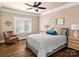 Bedroom with hardwood floors, window with plantation shutters, and sitting area at 7672 Nautical Vw, Denver, NC 28037