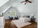 Large bedroom with hardwood floors, vaulted ceiling and seating area at 7672 Nautical Vw, Denver, NC 28037