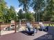 Large deck overlooking backyard with seating and firepit at 7672 Nautical Vw, Denver, NC 28037