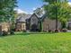 Curb appeal abounds in this charming stone home at 7672 Nautical Vw, Denver, NC 28037