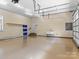 Spacious garage with epoxy floor, sink, and storage shelves at 7672 Nautical Vw, Denver, NC 28037