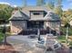 Brick house with large deck and patio, including a fireplace at 7672 Nautical Vw, Denver, NC 28037