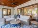 Relaxing screened porch with wicker furniture and ceiling fan at 7672 Nautical Vw, Denver, NC 28037