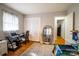 Well-lit bedroom with a twin bed, work area, and built-in closet at 7716 Elwood Dr, Charlotte, NC 28227