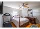 Bedroom with a double bed, dresser, and treadmill at 7716 Elwood Dr, Charlotte, NC 28227