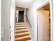 Simple staircase leading to the upper level at 7716 Elwood Dr, Charlotte, NC 28227