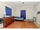 Simple bedroom with wood floors and twin bed at 830 Lowder St, Albemarle, NC 28001