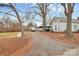 Gravel driveway leading to a charming home at 830 Lowder St, Albemarle, NC 28001