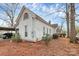 Rear view of the house showcasing a side porch and yard at 830 Lowder St, Albemarle, NC 28001