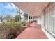 Spacious wrap-around porch with red brick pillars at 830 Lowder St, Albemarle, NC 28001