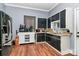 Bright kitchen with black appliances and white cabinets at 830 Lowder St, Albemarle, NC 28001