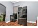 Kitchen features black appliances and wood flooring at 830 Lowder St, Albemarle, NC 28001