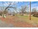 Spacious lot with mature trees and a gravel driveway at 830 Lowder St, Albemarle, NC 28001