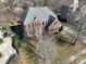 Brick house aerial view, two-car driveway, landscaped lawn at 8809 Landsdowne Ave, Harrisburg, NC 28075