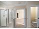 Bathroom with shower, toilet, and access to another room at 8809 Landsdowne Ave, Harrisburg, NC 28075