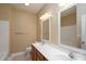 Bathroom with double vanity and updated fixtures at 8809 Landsdowne Ave, Harrisburg, NC 28075