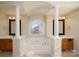 Elegant bathroom with a garden tub and double vanity at 8809 Landsdowne Ave, Harrisburg, NC 28075