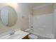 Clean bathroom, includes shower/tub combo and vanity at 8809 Landsdowne Ave, Harrisburg, NC 28075