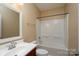 Clean bathroom with tub and updated vanity at 8809 Landsdowne Ave, Harrisburg, NC 28075