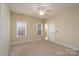 Spacious bedroom with ensuite bathroom access at 8809 Landsdowne Ave, Harrisburg, NC 28075