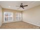 Bright bedroom with neutral walls and carpet at 8809 Landsdowne Ave, Harrisburg, NC 28075