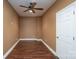 Spacious bedroom with wood flooring and ceiling fan at 8809 Landsdowne Ave, Harrisburg, NC 28075