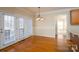 Breakfast nook with hardwood floors and access to backyard at 8809 Landsdowne Ave, Harrisburg, NC 28075