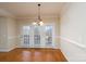 Bright breakfast nook with hardwood floors and French doors at 8809 Landsdowne Ave, Harrisburg, NC 28075