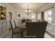 Virtually staged dining room, showcasing a formal dining setting at 8809 Landsdowne Ave, Harrisburg, NC 28075