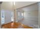 Bright entryway with hardwood floors and access to living room at 8809 Landsdowne Ave, Harrisburg, NC 28075