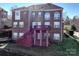 Brick home with large deck and stairs at 8809 Landsdowne Ave, Harrisburg, NC 28075