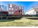 Brick home with multi-level deck and retaining walls at 8809 Landsdowne Ave, Harrisburg, NC 28075