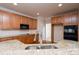 Kitchen boasts granite countertops and light wood cabinets at 8809 Landsdowne Ave, Harrisburg, NC 28075